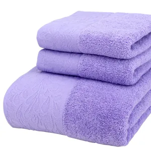 Purple 3-piece 100% cotton jacquard bath towel and hand towel set folded neatly on white background.
