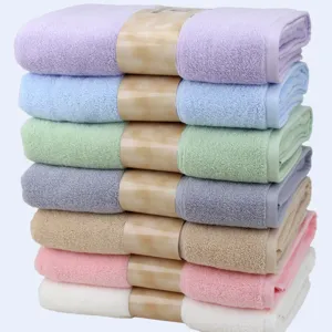 Set of colorful pure cotton bath towels stack, soft absorbent solid color bath towels.