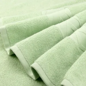 Light green cotton bath towel, soft and absorbent solid color bath towel folded display main image.