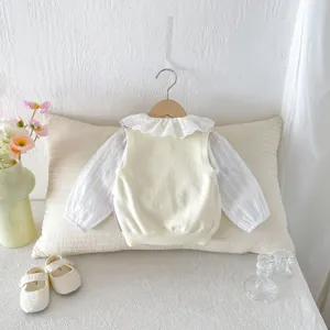 Toddler baby knit vest and lace collar blouse detail view, cute autumn outfit set for girls.