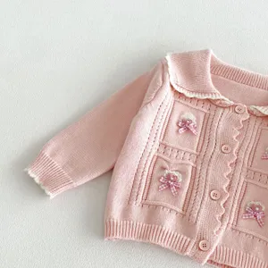 Pink baby girl knit cardigan detail, cute doll collar, button closure and bow decor.