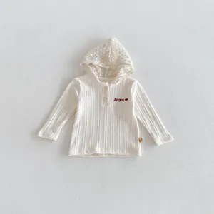 Detailed view of the baby lace hooded ribbed sweatshirt featuring delicate floral lace trim.