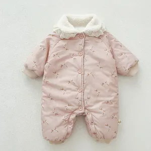 Detailed view of baby winter padded romper featuring floral print, cozy fleece collar and buttons.