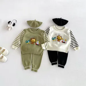 Detailed view of kids cute cartoon knit sweater set with matching beret and striped sleeves.