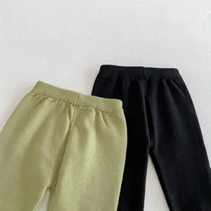 Comfortable knit baby pants in green and black, soft cotton material, ideal for daily wear.