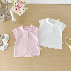 Close-up detail of infant ribbed polo short-sleeve top showing collar and button features.