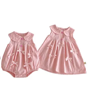 Conjunto de mameluco rosa sin mangas y vestido bonito para bebé niña con lazos encantadores.