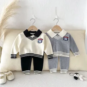 Detailed view of baby knit sweater set featuring contrast collar and stylish stripes design.