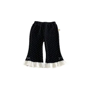 Toddler girls black polka dot flare pants with white lace ruffles for autumn daily wear.