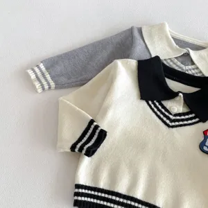 Detailed view of toddler knit sweater featuring contrast color lapel collar and striped cuffs.