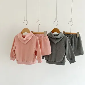 Baby waffle knit hoodie and shorts set detail view, featuring soft texture and cozy cotton fabric.