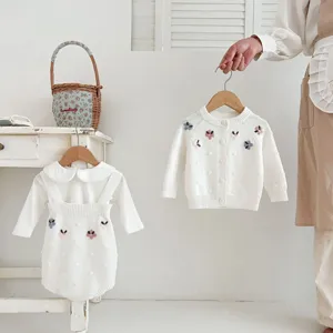 Infant baby girl knitted sweater set with floral embroidery cardigan and strap romper outfit.