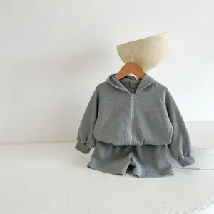 Infant gray waffle hoodie and shorts set detail, soft cotton baby clothing for autumn.