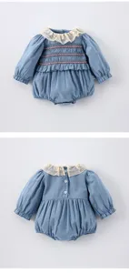 Details of the baby girl romper featuring lace collar, smocked bodice, and long puff sleeves.