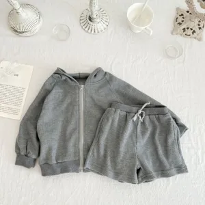 Infant grey waffle knit hoodie and shorts set flat lay detail, cozy baby autumn clothing.