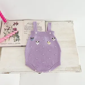 Cute baby knitted romper with floral embroidery and sweet dot pattern. Soft cotton material.