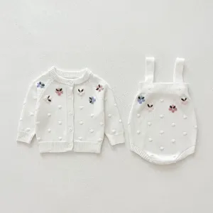 Infant baby cotton knit cardigan and strap romper set with delicate handmade floral embroidery.