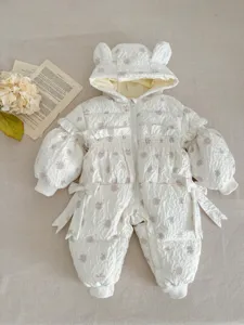 Infant winter white quilted hooded romper detail, cute bear ears and sweet floral print design.
