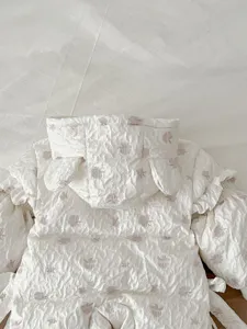 Infant baby winter down jumpsuit with cute hood and ruffle details, warm white snowsuit.