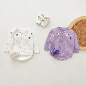 Infant baby girl knit cardigan romper set with floral embroidery and beaded bag detail.