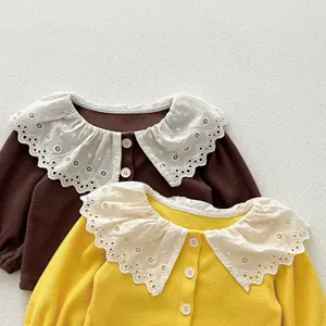 Toddler girls waffle knit cardigan detail with large white lace collar and button closure.