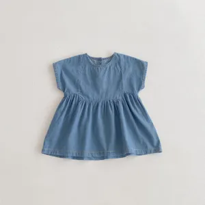 Soft denim baby dress detail, round neck and gathered skirt design for kids summer daily wear.