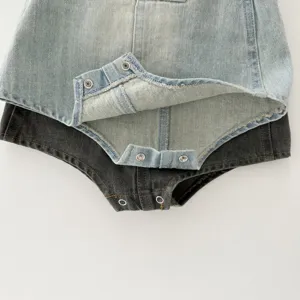 Infant denim romper detail view, baby snap button bodysuit, soft cotton fabric texture.