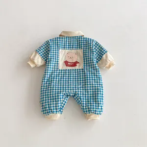 Cute baby winter plaid romper detail showing back pocket with lovely cartoon bear design.