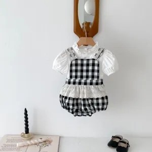 Cute baby girl summer plaid romper set with white puff sleeve blouse and suspender bloomers.
