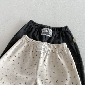Detailed view of toddler floral pants elastic waist casual trousers close up fabric texture