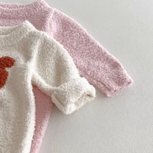 Close-up detail of thick plush baby rompers in pink and white, warm long-sleeve infant jumpsuits.
