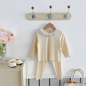 Cute baby girls autumn two-piece set with long sleeve ribbed top and adorable lace doll collar.