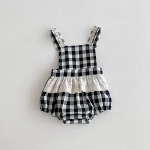 Cute black and white gingham baby romper with delicate lace trim, perfect for summer infant wear.