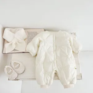 Infant winter quilted romper set detail view, creamy white floral embroidery fabric and fuzzy texture.