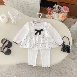 Sweet baby girls three-piece autumn outfit set featuring polka dot camisole, top and pants.