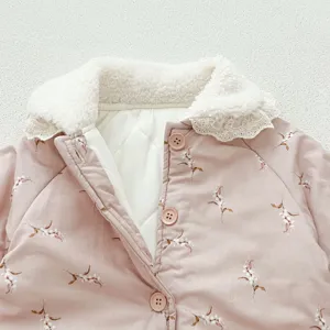 Cozy baby winter romper detail with cute floral print, soft sherpa collar, and warm quilted lining.