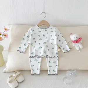 Detailed view of cute floral children sleepwear set with ruffles for autumn cozy home.