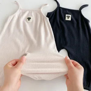 Close-up view of ribbed fabric baby romper, soft stretch material detail presentation