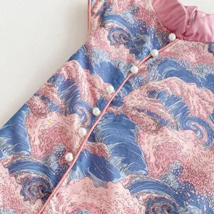 Detailed shot of girls chinese style qipao dress, pink blue wave pattern, pearl button trim.