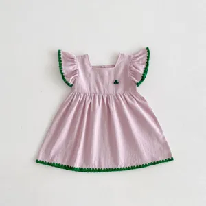 Cute pink baby toddler girl dress with green ruffle trim summer detail view product display