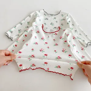 Kids floral long sleeve knit top detail showing cute ruffle collar and cotton fabric