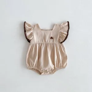 Infant baby girl summer bodysuit with fly sleeves and cute brown trim details, lightweight.