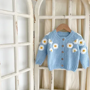 Infant baby blue knit cardigan featuring cute white daisy embroidery, long sleeves, wooden buttons.
