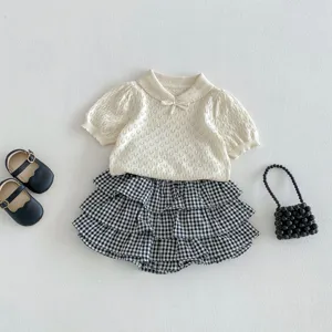 Toddler baby girls summer knit top and black white gingham tiered ruffled skort outfit set.