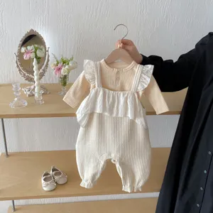 Baby ribbed ruffle romper detail view, sweet cotton newborn jumpsuit for daily wear and photos.