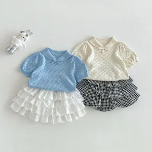 Infant sweet princess style summer knit top with tier skirt and checkered shorts detailed shot.
