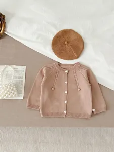 Infant knit cardigan set with matching beret, cute cable knit details and soft cotton material.