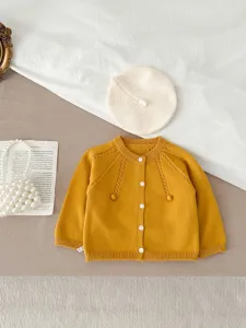 Autumn baby knitted cardigan, cute solid color toddler sweater coat with cute pom-pom details.