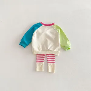 Baby girls spring knit clothing set with colorblock sweatshirt and striped leggings detail.