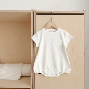 Baby ribbed short sleeve romper with chest pocket and bottom snap buttons detail.